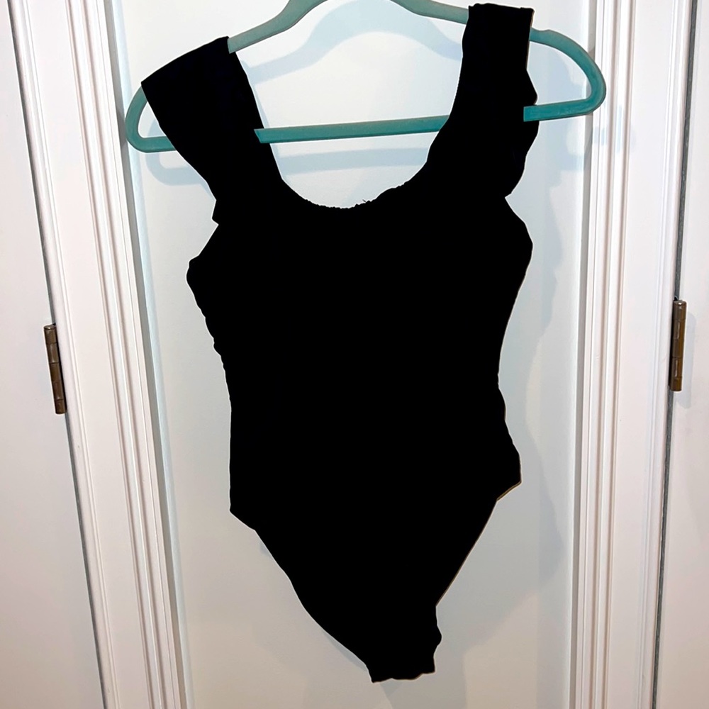 Black ruffle top bodysuit or swimsuit